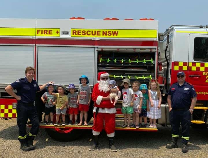 PERFECT POSE: The Burradoo Bowral Playgroup celebrated the festive season last year with Fire and Rescue NSW and Santa Claus himself. Photo: Supplied.