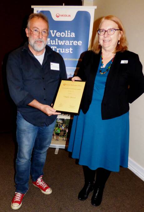 THEATRE DIRECTOR: Chrisjohn Hancock from Goulburn receives his 2018 Veolia Creative Arts Practice Scholarship from Jenny Kena. Photo: Supplied