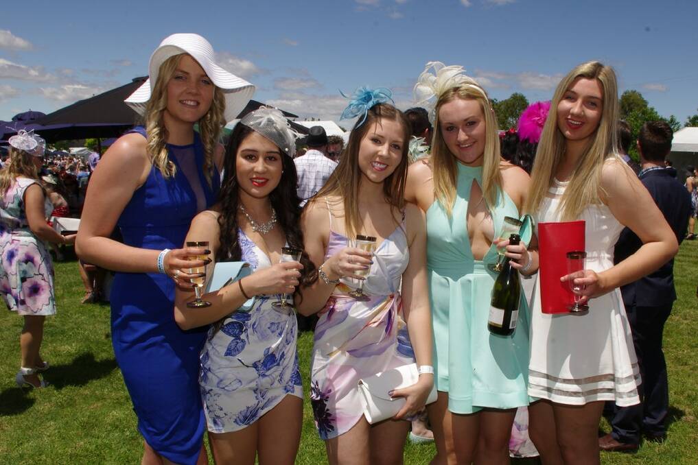 FASHIONABLE: Five young local ladies at the 2015 Girls' Day Out enjoying the carnival atmosphere and a warm sunny afternoon of racing. Photo: Darryl Fernance