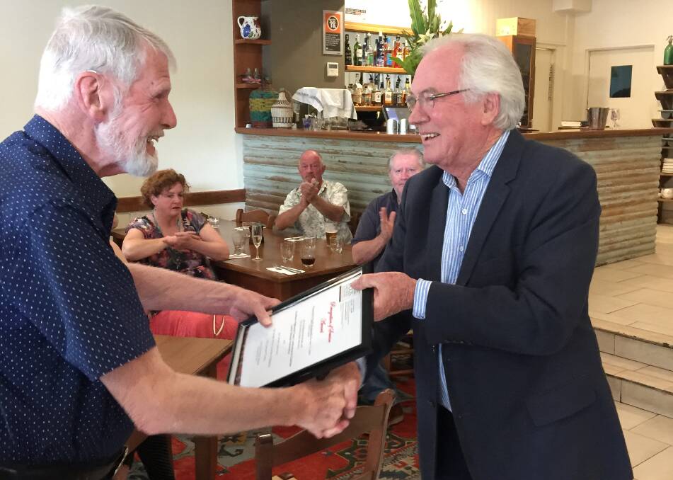 Geoff Wadsworth received his 15 year award from Laurie Stewart at the Christmas party. Photo: supplied