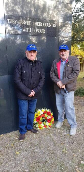 Veterans Rod Cashmere (left) and John Stead (right) lay a wreath at the
Bowral Vietnam Memorial on Friday, May 11. Photo: supplied