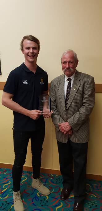 STRONG SEASON: Lachlan Huntington (Illawarra player of the year) with IDRU president  Peter Woods. Photo: supplied