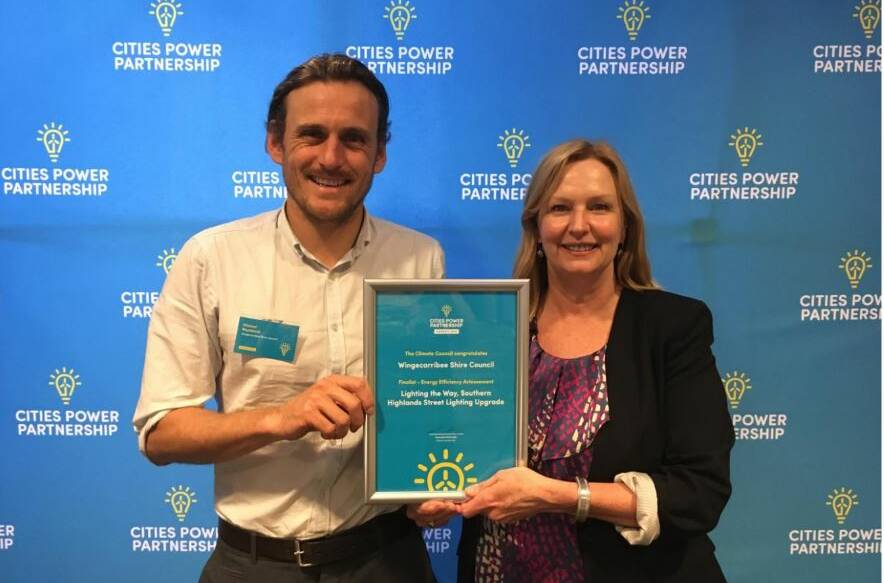 Environment and Sustainability team members Michael Rhydderch and Therese Smart accept the Cities Power Partnership award. Photo: supplied
