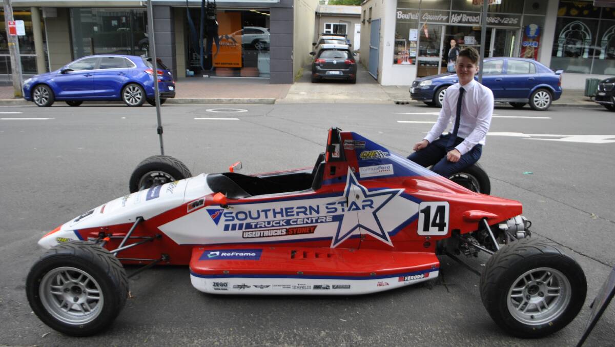 Southern Highlands driver Lachlan Mineeff with his Formula Ford. Lachlan made a speech at the service. Photo: Emily Bennett