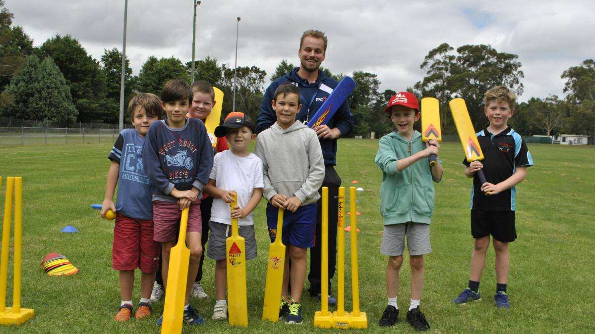 PCYC's Kristchan Keller with the outdoor cricket group at a school holidays clinic earlier this year. Photo: SHN