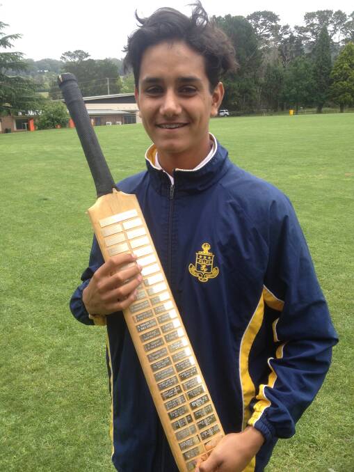 CRACKING CENTURY: Ravi Wikramanayake scored 114 runs over the weekend and got his name on the Oxley College Centurion’s Bat which has a plaque for every cricket who has scored a century for the school. Photo: supplied