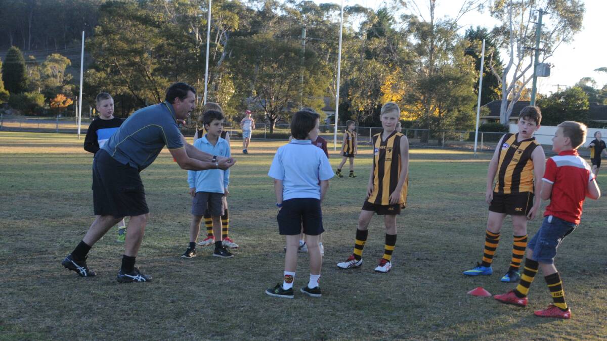 Steve Fitzgerald works with the Highland Hawks players on their skills at training.