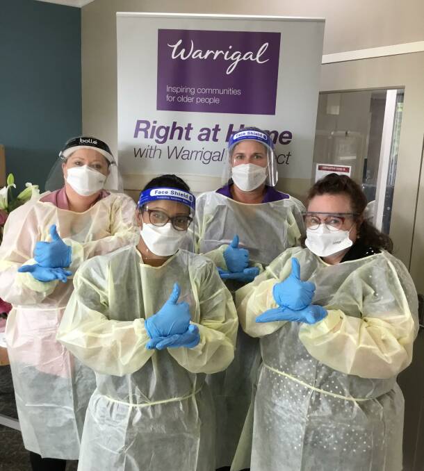 TOP EFFORT: Warrigal staff at Goulburn, decked out in full PPE gear, have worked longer hours amid shortages imposed by COVID-19. L-r: Jenna Moorby, Ashaki Rana, Dot Dewsbury and Susan Boden. Photo supplied.