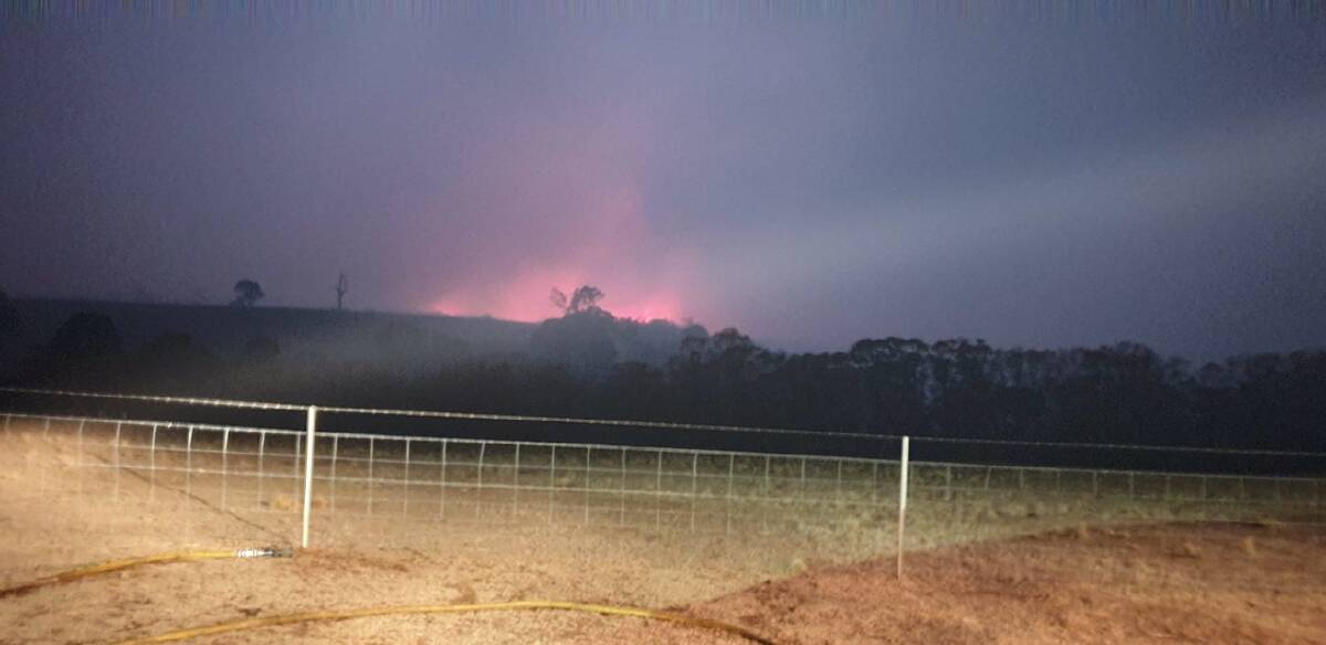 Tallong Bushfire Brigade captured this shot of the Currowan fire rearing its head around the village on Saturday night. 