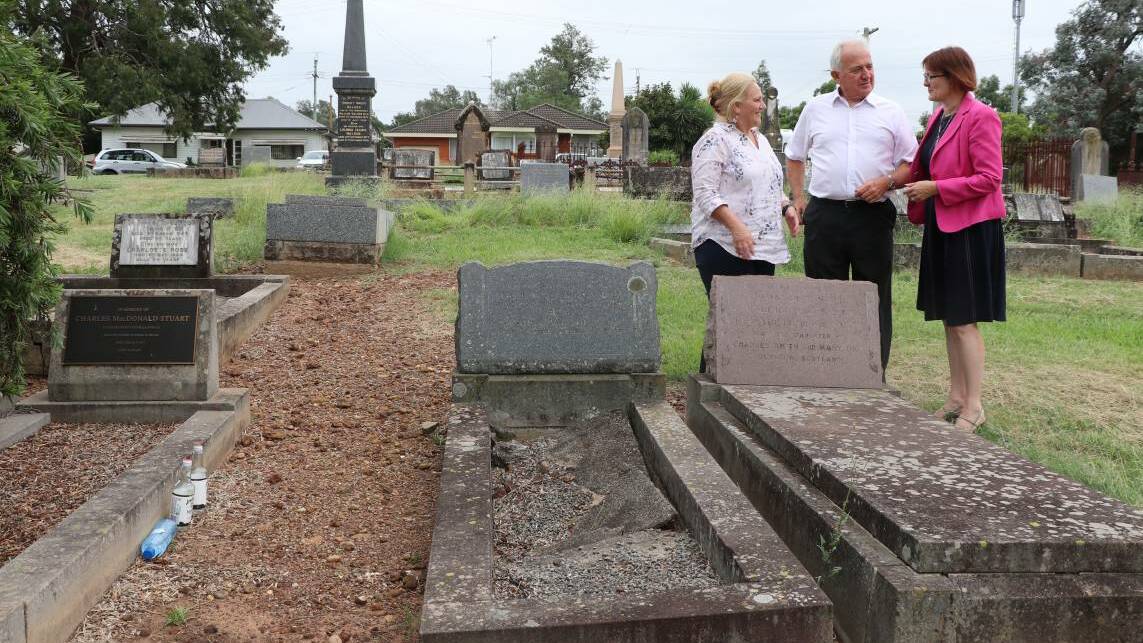 Memorial: Susan Templeman MP (right), Mary Lyons-Buckett and John Leek at the cemetery where Mr Whirlpool is buried in an unmarked grave. They are standing next to the grave of John Dick Smith, who was the only person to attend Mr Whirpool's funeral. It also shows an example (in the background on the left) of the type of memorial the team are hoping to gain for Mr Whirlpool. Picture: Supplied

