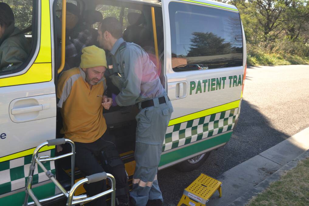 PAINFUL TRIP: Highlander John McFadden trying to get on the patient transport bus for dialysis with a broken leg. Photo: supplied. 