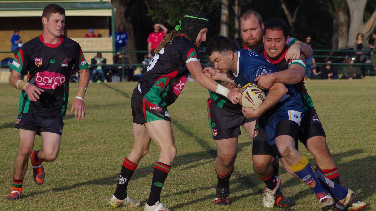 BUNDANOON'S VICTORY: The Bundanoon Highlanders in action against the Bargo Bunnies at Appin Park during round 11. Photo: Phil Benson. 