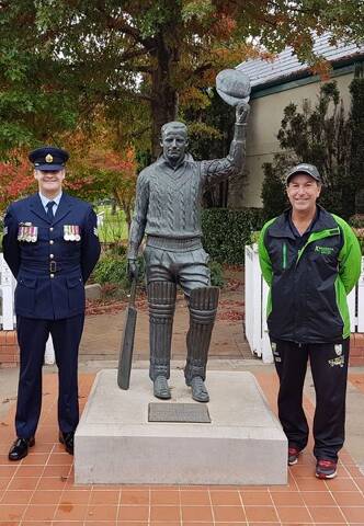 RAAF Sergeant Graham Gleeson with Cricket Officer Jock McIllhatton  at Bradman’s ‘a final salute’ statue, Bradman Museum.