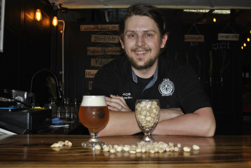 NUTTY BREW: Eden Brewery's Jacob Newman with a glass of Pistachio Cream. Photo: Madeline Crittenden. 