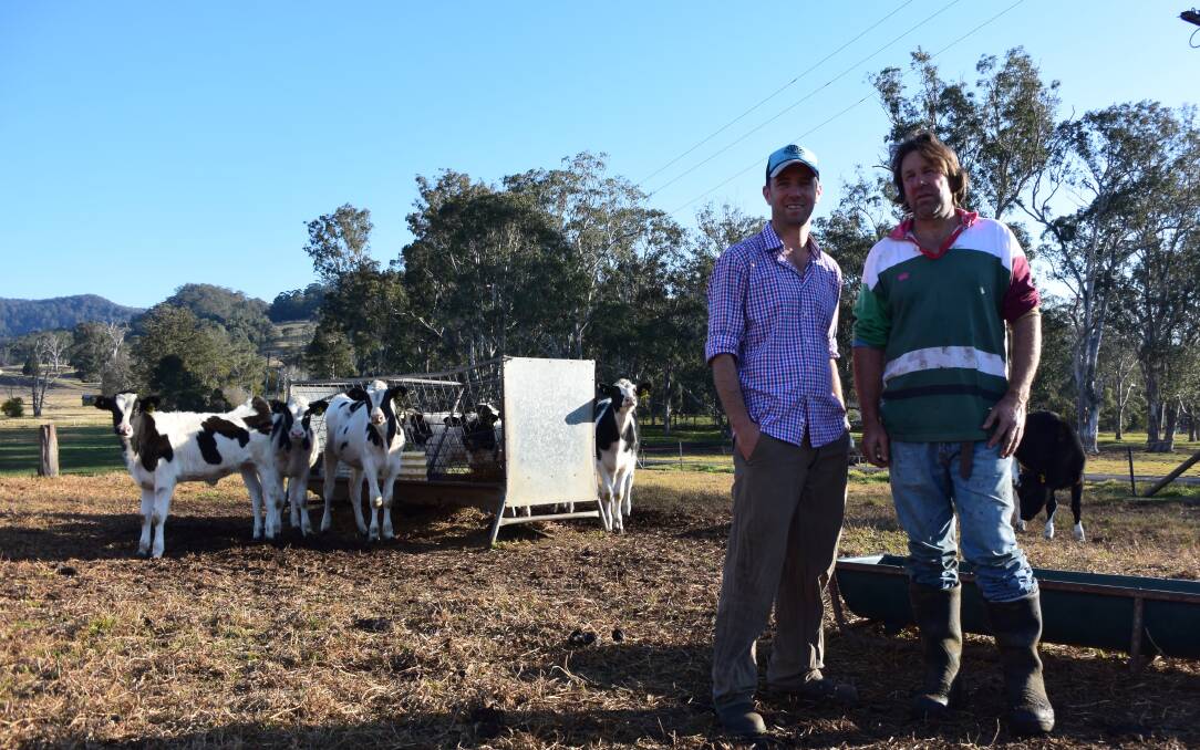 HELPING HAND: Mark McLennan and Gavin Chittick at the Chittick dairy farm at Kangaroo Valley. 