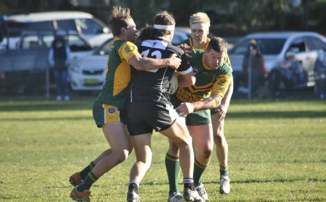 NEW SEASON: Mittagong Lions' Jesse Elliott (right) combines with a Mittagong team mate in defence during a Group 6 match last year. Photo: Josh Bartlett. 