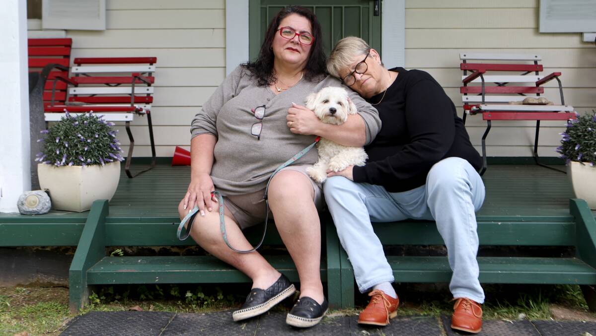 Teresa Stephen and Janet Williams with their dog Stephen, after their two other dogs were killed by a snake in their backyard. Picture by Sylvia Liber