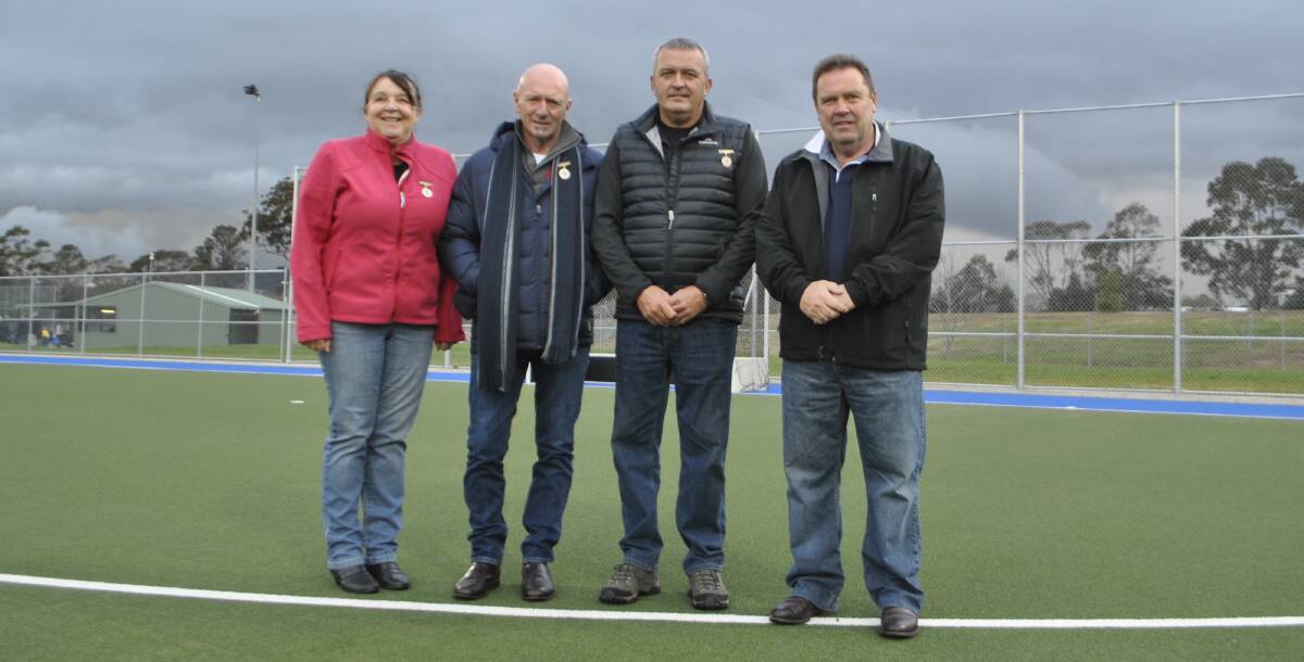HARD WORK PAYS OFF: Sandra Sharpe, Steve Bedson, Glen Isedale and David Mackay helped secure a new second turf at Welby Hockey Fields. Photo: Emily Bennett