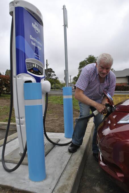 WAY OF THE FUTURE: Mark Roberts charges his vehicle with the new fast charging station at Mittagong. Photo: Emily Bennett
