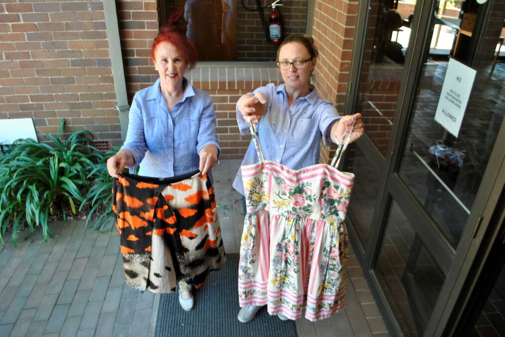 DRESS FOR SUCCESS: Pre-loved designer clothing sale organiser Barbara Lawson and Lucy Earl with some of the clothing to go on sale on Saturday. 