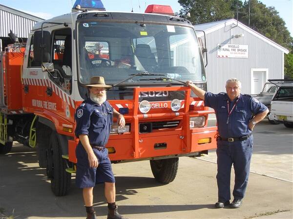 PARTNERS IN FIREFIGHTING: The late Trevor Christie with Rural Fire Service (RFS) community safety officer Inspector David Stimson. Photo: SHN file