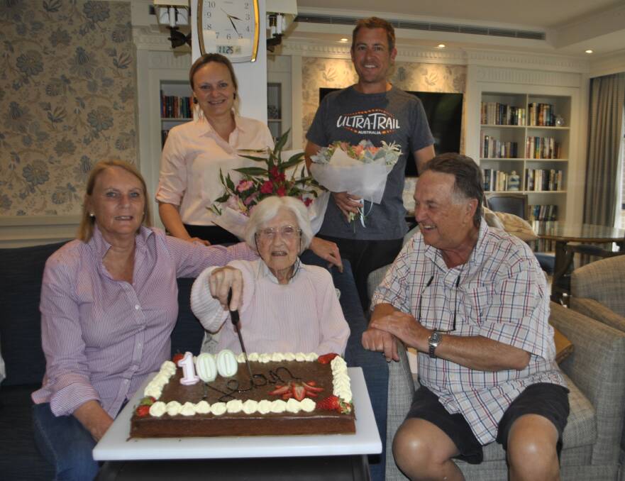 HIP HIP HOORAY: 100-year-old Jean Tollis with her family members Sam Tollis, Simon Lightfoot, Anne Tollis and Garrie Tollis at Bowral House Nursing Home on Monday. Photo: Emily Bennett