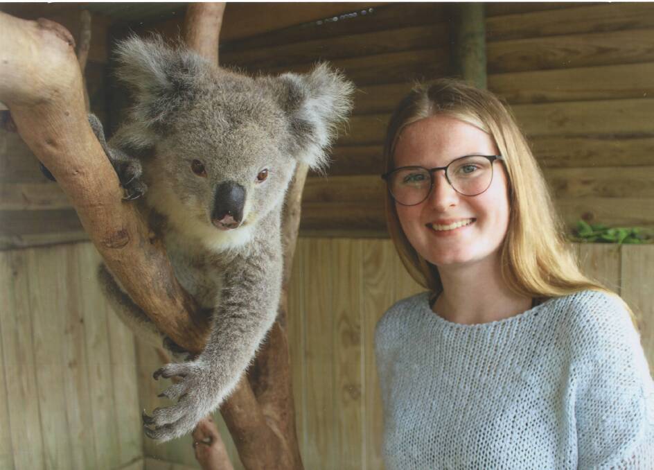 A KOALITY STUDENT EXCHANGE: German exchange student Finnja Schweers with a koala at Symbio Wildlife Park. Photo: Supplied