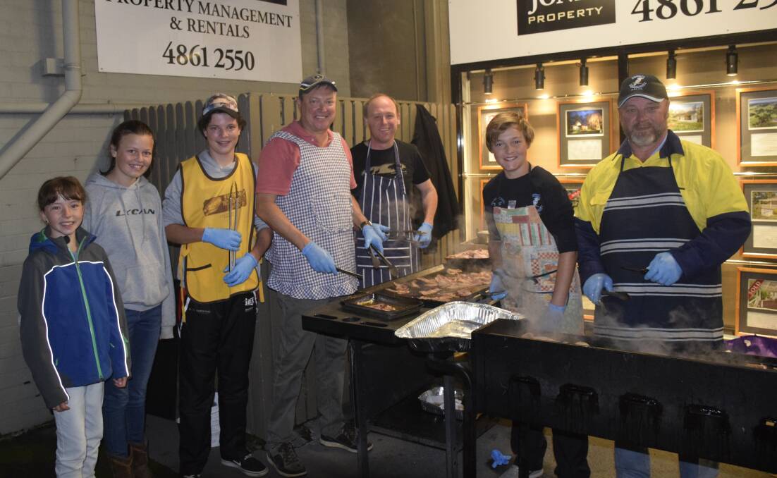 SERVED WITH A SMILE: The Morton and Hyland family are the friendly faces behind an annual dawn service barbecue breakfast. Photo: File