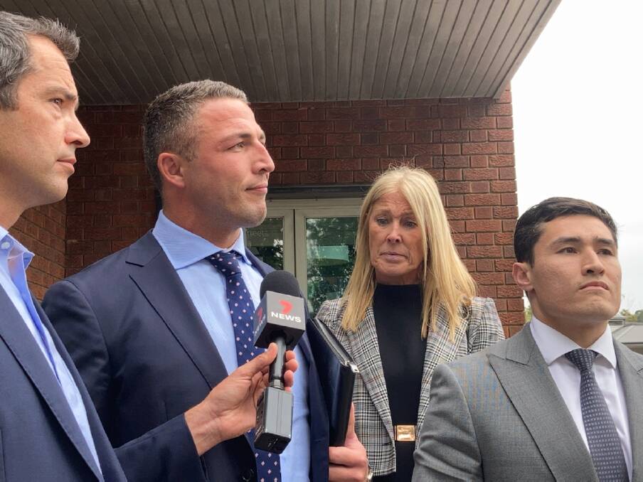 Former NRL star Sam Burgess, his mother Julie Burgess and one of his lawyers Bryan Wrench were approached by journalists in Moss Vale on Monday, November 16. Photo: Southern Highland News