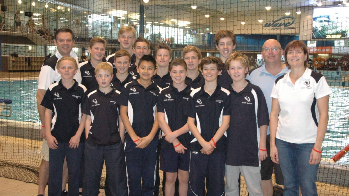 ACCOMPLISHED: Coach Brad Gipson, manager Alison Oates and Jonathan Hatcher with the Southern Highlands Water Polo under 14 boys team, the Honey Badgers.