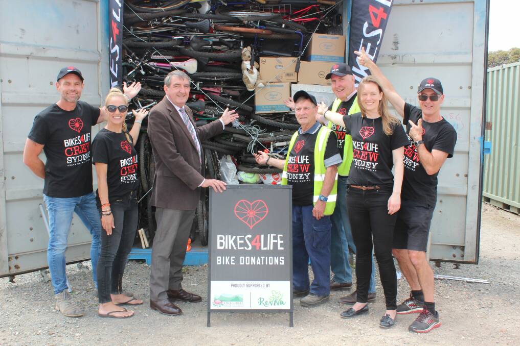 GREAT CAUSE: Wingecarribee Shire Council mayor Duncan Gair with Bikes 4 Life volunteers at the Resource Recovery Centre. Photo: Supplied