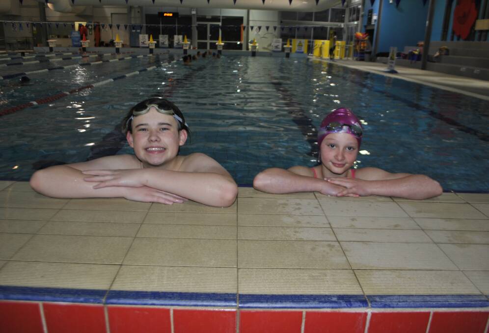 Moss Vale Swim Club members, 13-year-old Declan Englefield and 10-year-old Jessica Wray at Moss Vale Aquatic Centre. Photo: Emily Bennett