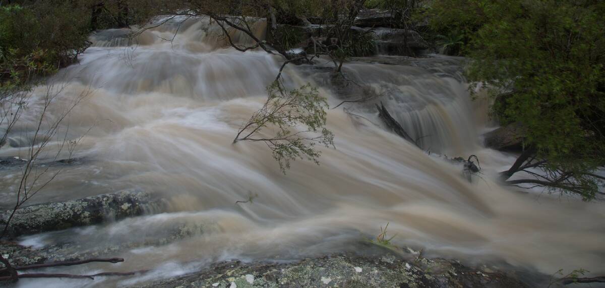 WATERFALL: Heavy rainfall lashed towns and villages across the Southern Highlands on Wednesday, including off Drapers Road in Colo Vale. Photo: Bodhi's Photography