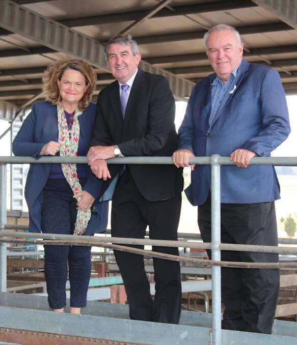 Goulburn MP Wendy Tuckerman, Wingecarribee Shire Council mayor Duncan Gair and councillor Ian Scandrett at the Southern Regional Livestock Exchange. Photo: Supplied