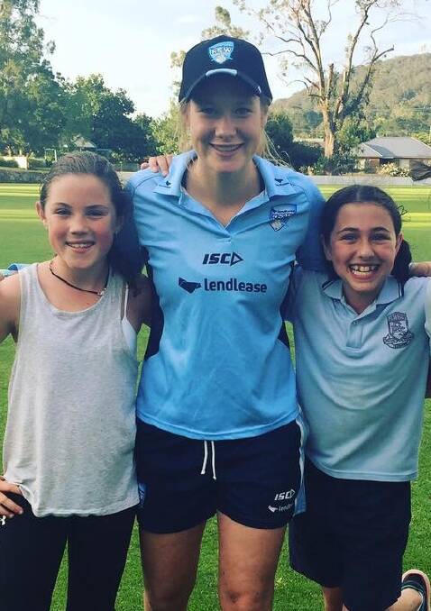 ROLE MODEL: Bowral Cricket Club Primary players Sophie Taufel and Ava Maiden with Lauren Cheatle. Photo: Contributed