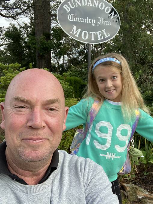 SUPPORT SMALL BUSINESSES: Bundanoon Country Inn Motel manager Andrew Compton with his eight-year-old daughter Arabella. Photo: Supplied