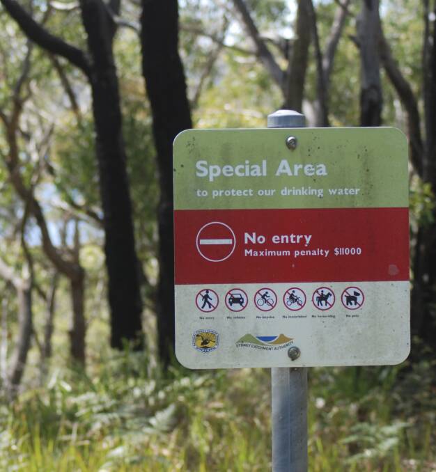 Stay out: A sign near Cataract Dam in the metropolitan special area catchment warns the public to stay clear of the area. Picture: Ben Langford
