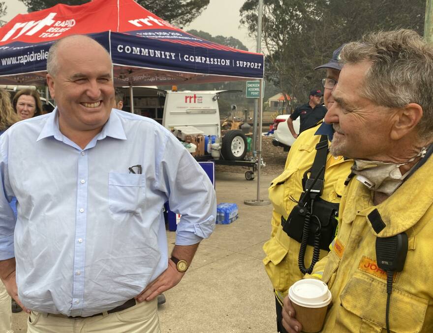 All smiles: NSW Emergency Services minister David Elliott speaking with Jamberoo brigade volunteer John Friedmann at Wingello on Sunday. Picture: Shannon Tonkin