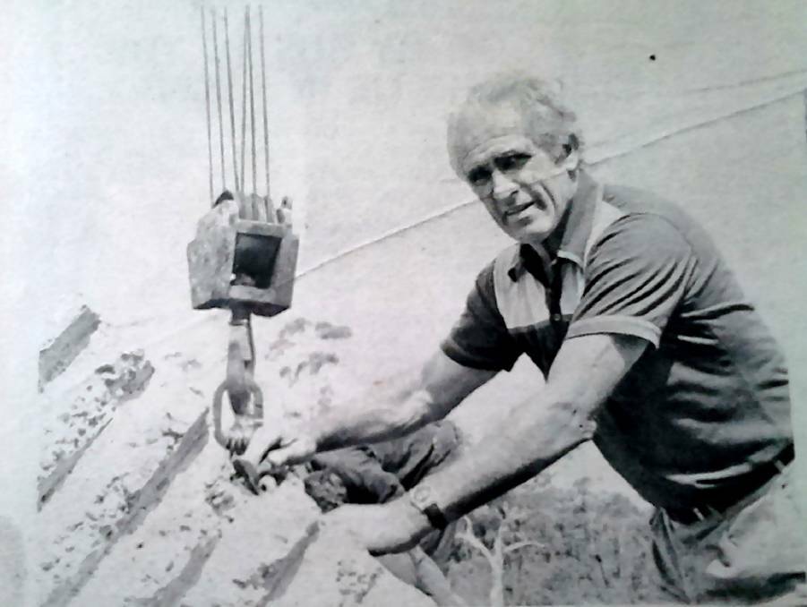 Funds could help preserve old photographs, such as this one of sculptor Joe Enfield raising his Hill Top concrete sculpture in 1980. Photo: SH News/BDH&FHS