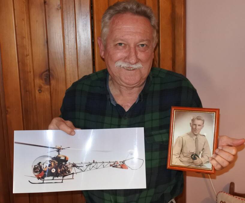 John Stead holding a photograph of the helicopters he worked on and a picture of himself in the army. Photo: Claire Fenwicke