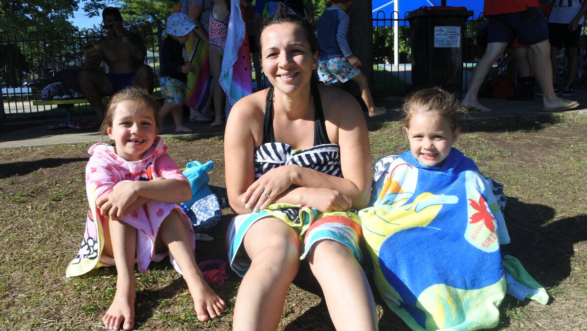 Cool after school: Lucy (5), Nuray Shepherd and Ally (3) came down from Mittagong to take advantage of Bowral pool's extended hours.
