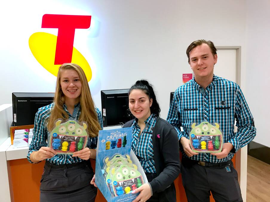 Mittagong Telstra store team members are selling Monster Crayons throughout March. Photo: supplied
