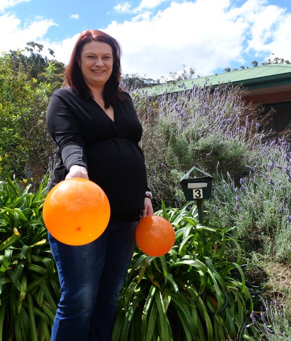 All Hallow's Eve elf: Mittagong woman Rochelle Bray is hand-dropping balloons into letterboxes for Halloween, to encourage children to only trick-or-treat at houses with a balloon. Photo: Claire Fenwicke