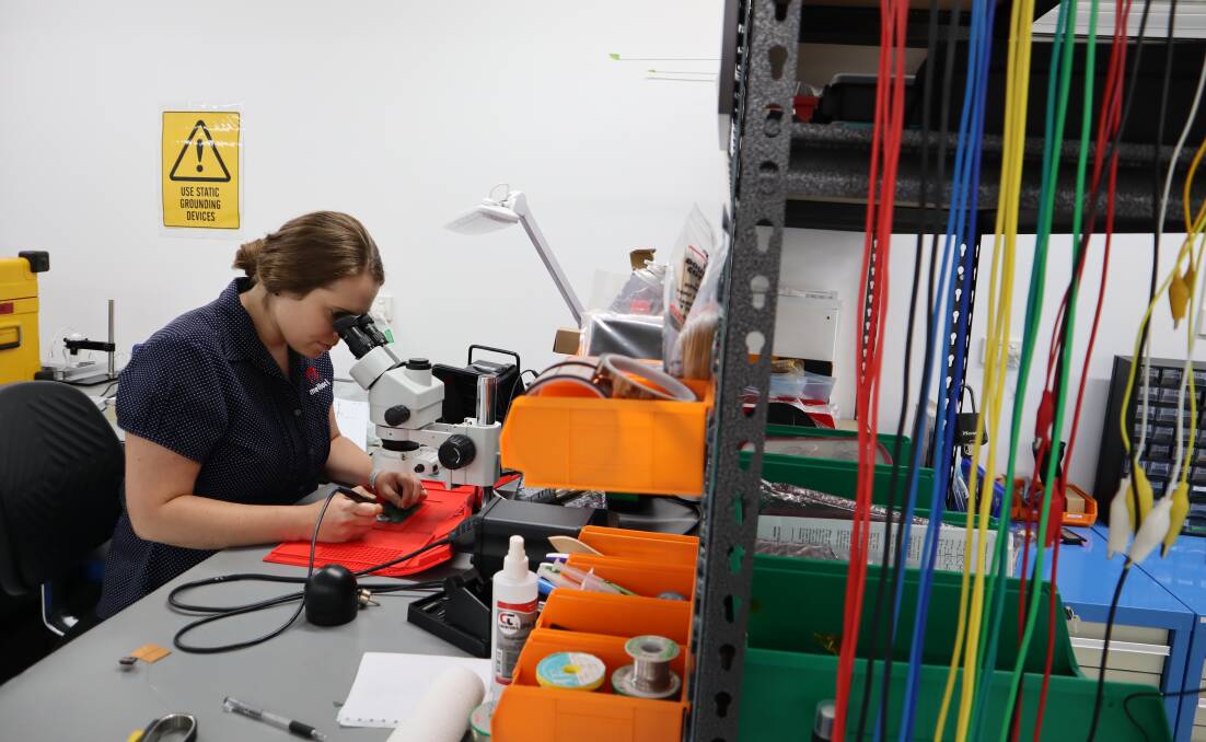 SKILL: Electronics engineer Adel Swanepoel, soldering and assembling printed circuit boards. Adel will be at the Women in Aviation stand on Sunday, November 28. Image: Supplied