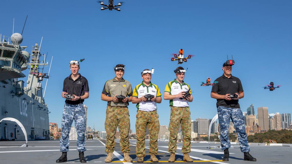 Members of the Australian Army Drone Racing Team (ADRT) conducted a demonstration display of skills on the flight deck of HMAS Canberra docked in Sydney Harbour. Photo ADF