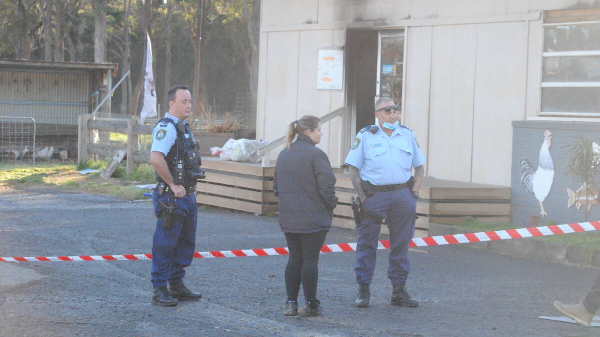 INVESTIGATIONS: South Coast Police officers at Jervis Bay Stock Feeds on Wednesday morning. Photo: Damian McGill
