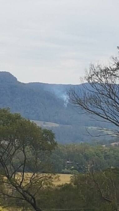 Mountain Blaze: Smoke from a lightning strike on Barrengarry Mountain. Photo: Kangaroo Valley RFS

