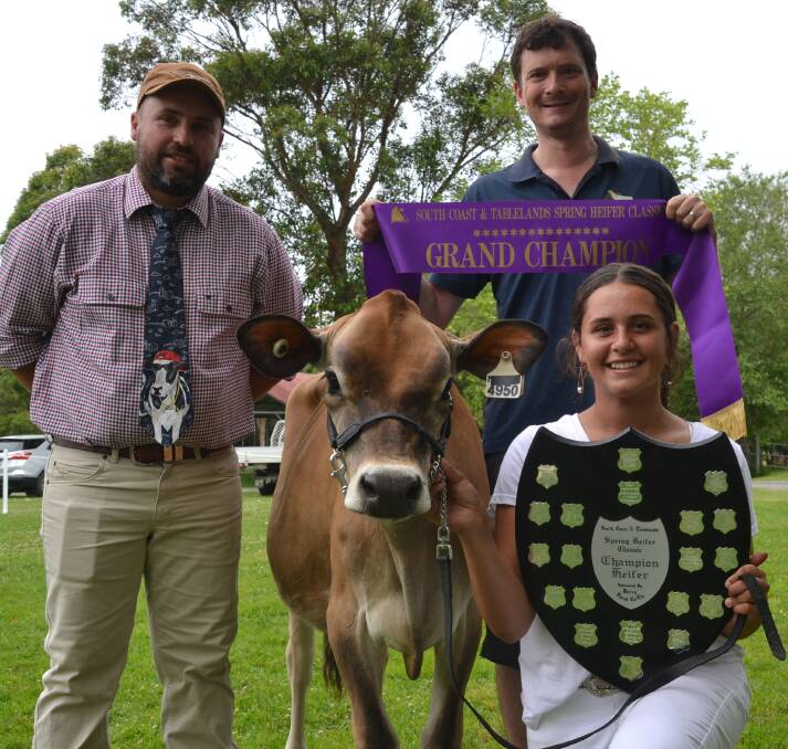 CHAMPION: Grand champion at this years South Coast and Tablelands Holstein Association Spring Heifer Classic was Rivendell Sentry Cleo shown by Elly Simms being congratulated by judge Pat Buckley (left) and Jared Cochrane of Raine and Horne Nowra.