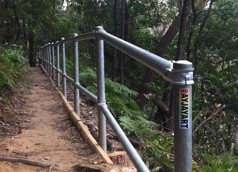 SAFETY: Steel safety railing has been installed along some of the steep cliff drop off areas.