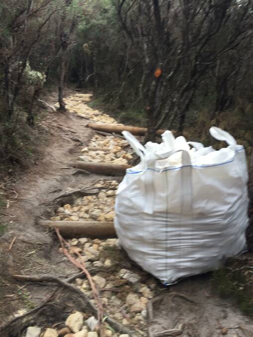 BIG JOB: Helicopters have been used to drop in a number of bags of sandstones and steps on the Drawing Room Rocks walking track, as part of a $150,000 upgrade.
